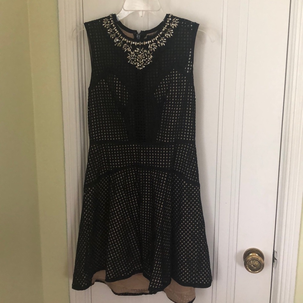 Black and Nude Dress with Embellished neckline.